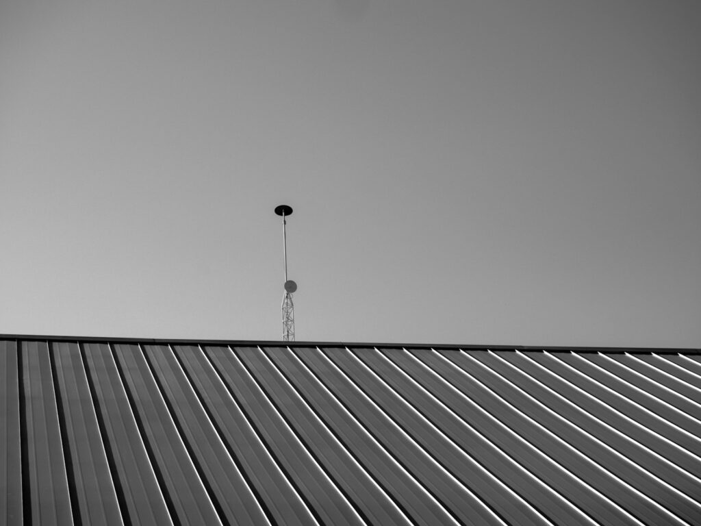 a black and white photo of a metal roof